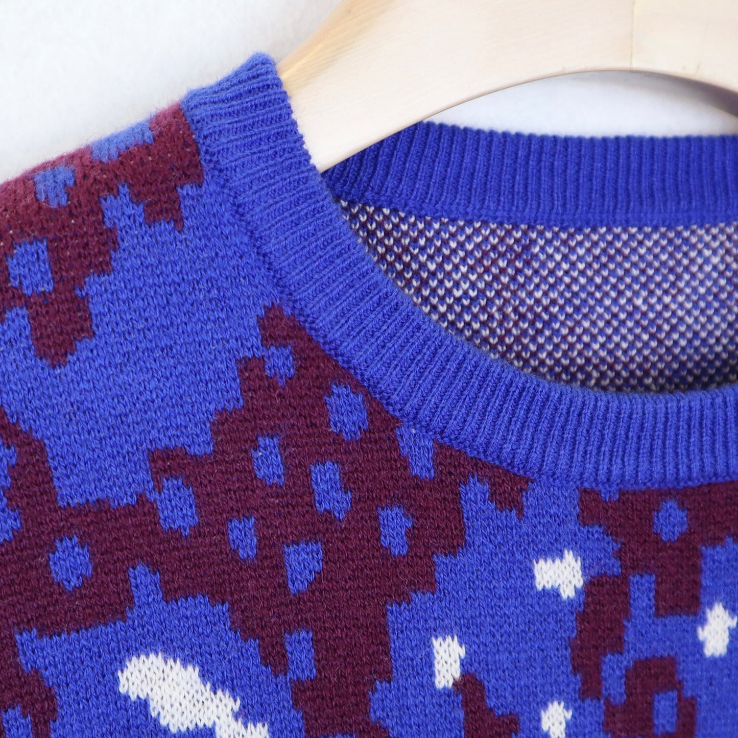 Blue Sweater with Red and White Patterns